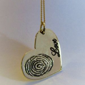 Heart-shaped pendant. I love you necklace.